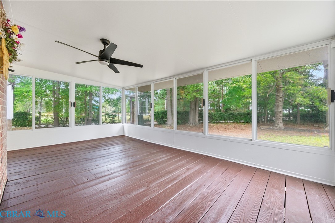 718 Dandy Loop Road Yorktown, VA 23692 - Photo 28 of 42 Unfurnished sunroom with a ceiling fan