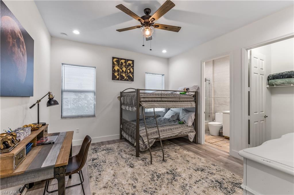 4410 Caldera Circle Naples, FL 34119 - Photo 24 of 30 a living room with furniture and a chandelier