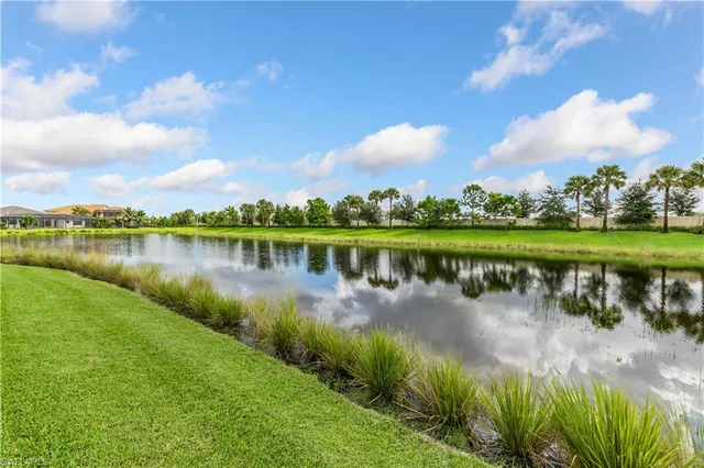 a view of a lake with houses in the back