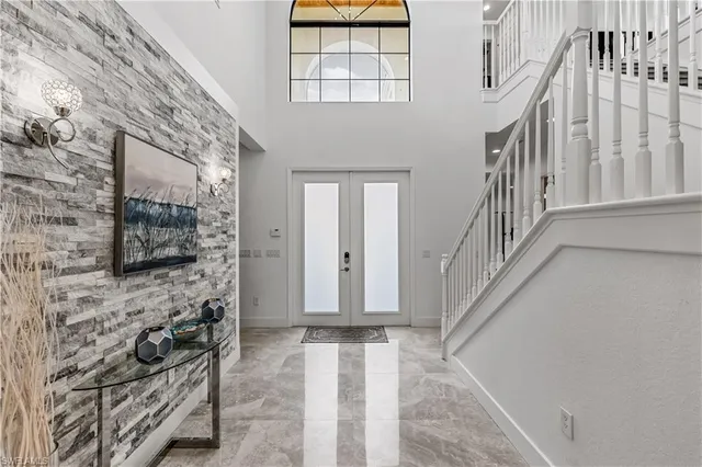 a view of entryway with a front door and wooden floor