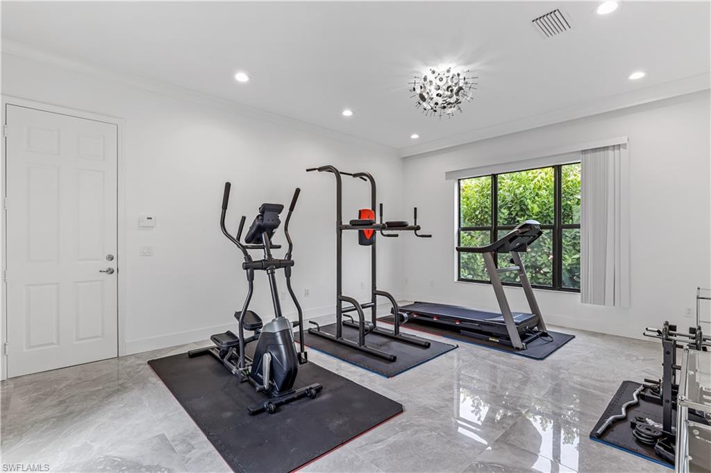 4410 Caldera Circle Naples, FL 34119 - Photo 8 of 30 a view of a room with gym equipment