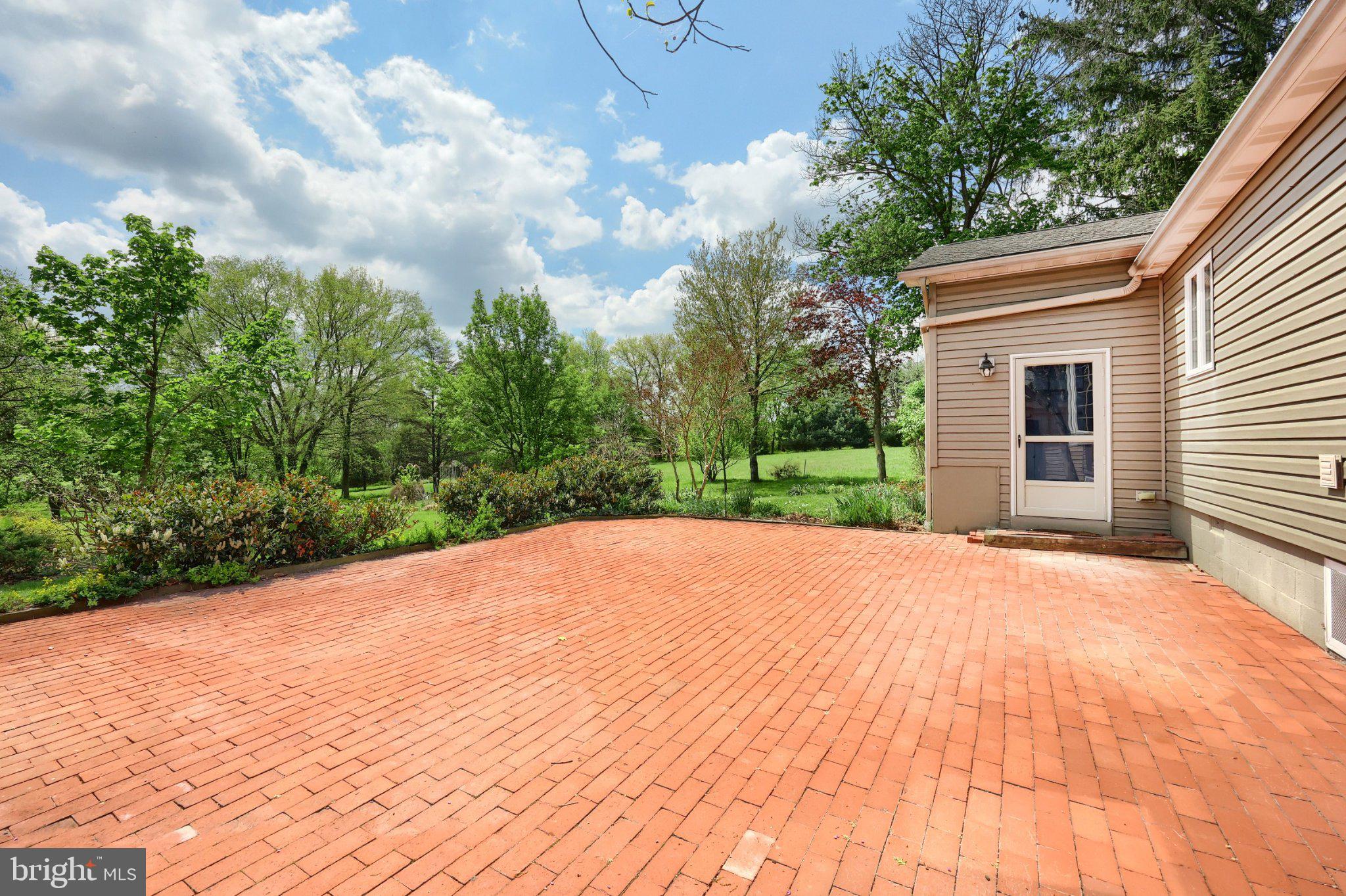 1974 Yingling Drive Spring Grove, PA 17362 - Photo 20 of 69 Sunny patio with lush greenery.
