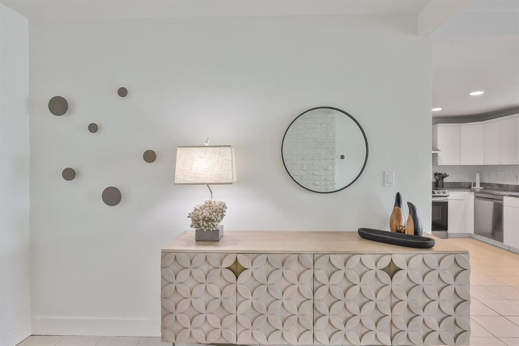 387 12th Avenue Indian Rocks Beach, FL 33785 - Photo 21 of 44 a bathroom with a sink mirror and vanity