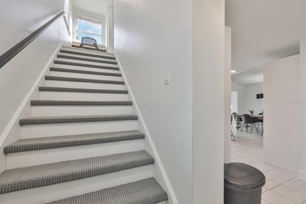 387 12th Avenue Indian Rocks Beach, FL 33785 - Photo 32 of 44 a view of entryway and hall with wooden floor