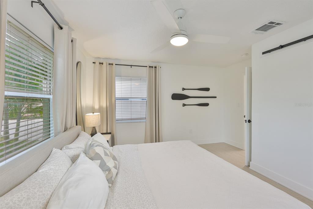 387 12th Avenue Indian Rocks Beach, FL 33785 - Photo 40 of 44 a bedroom with a bed and a window