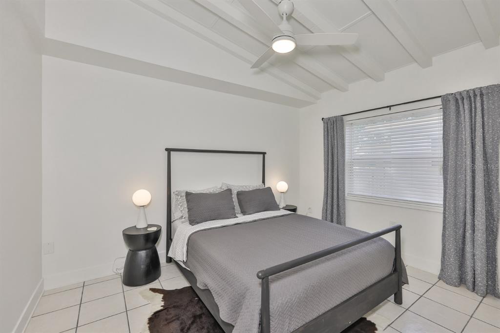 387 12th Avenue Indian Rocks Beach, FL 33785 - Photo 41 of 44 a bedroom with a bed and window