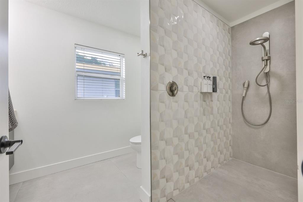 387 12th Avenue Indian Rocks Beach, FL 33785 - Photo 43 of 44 a bathroom with a shower