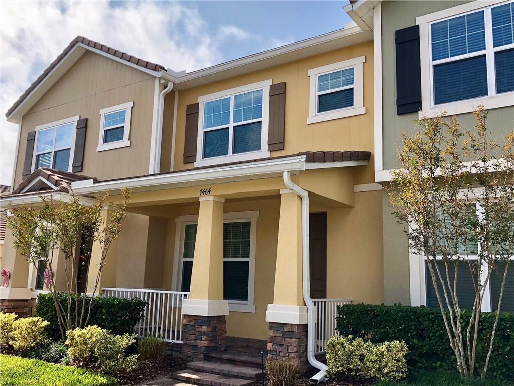 7464 Ripplepointe Way Windermere, FL 34786 - Photo 1 of 1 a front view of a house with a garden
