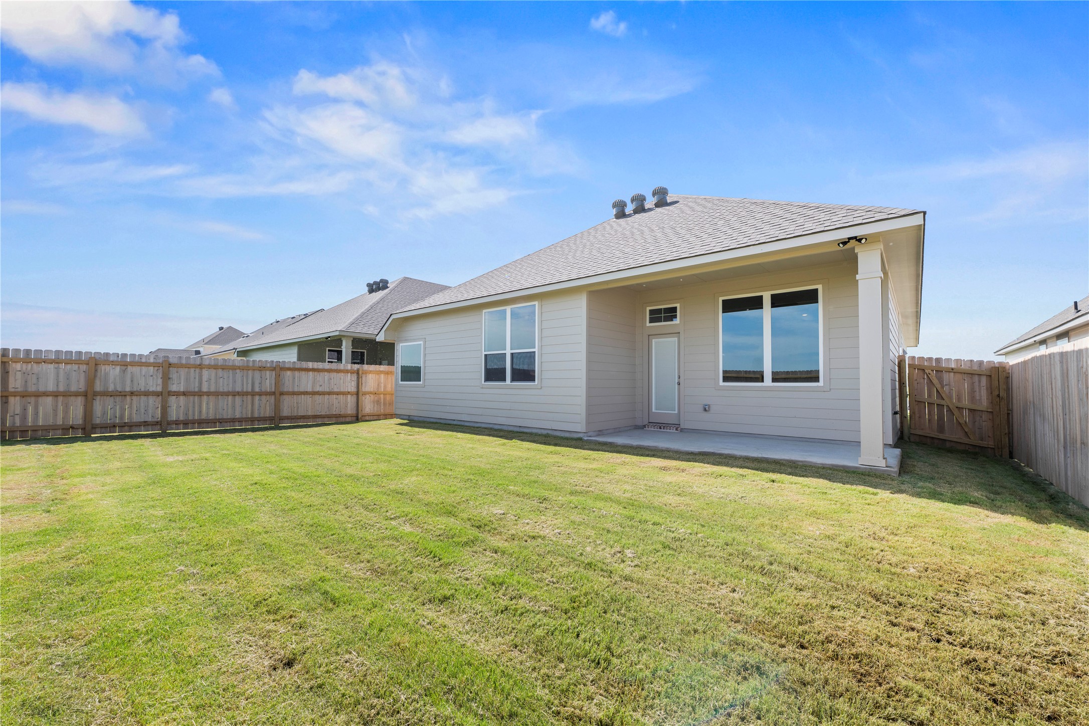 220 Gus Loop Georgetown, TX 78626 - Photo 18 of 18 A spacious, verdant yard with a sturdy privacy fence provides ample outdoor living.