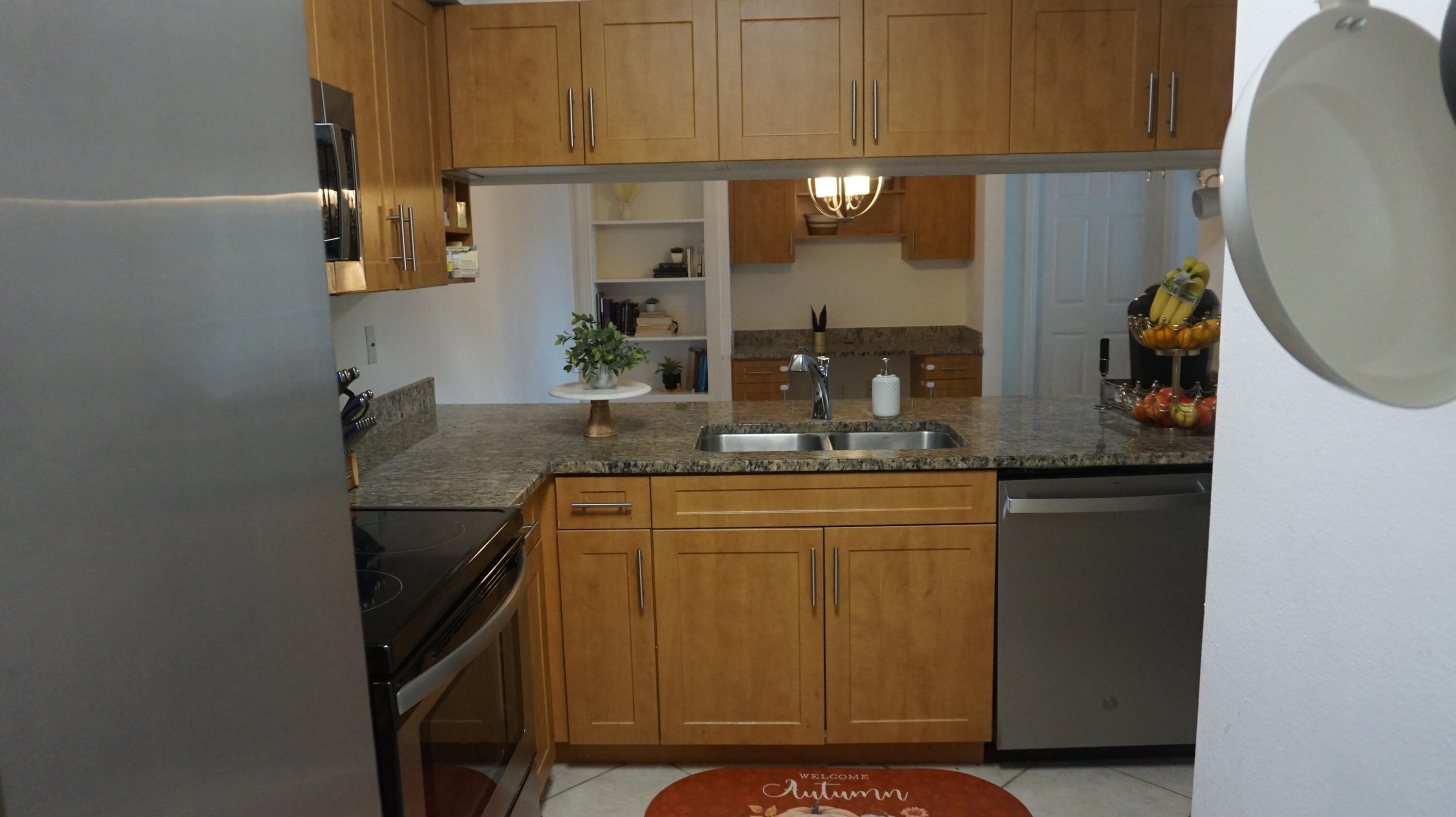 6511 Emerald Dunes Drive, Unit 208 West Palm Beach, FL 33411 - Photo 16 of 51 a bathroom with a sink and a mirror