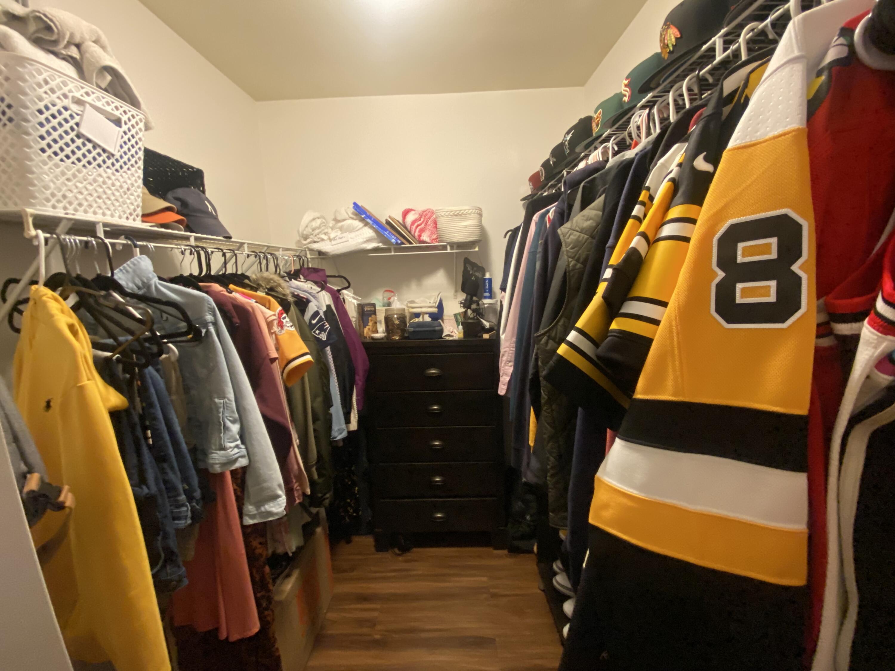 6511 Emerald Dunes Drive, Unit 208 West Palm Beach, FL 33411 - Photo 30 of 51 a view of walk in closet with clothes and shoes
