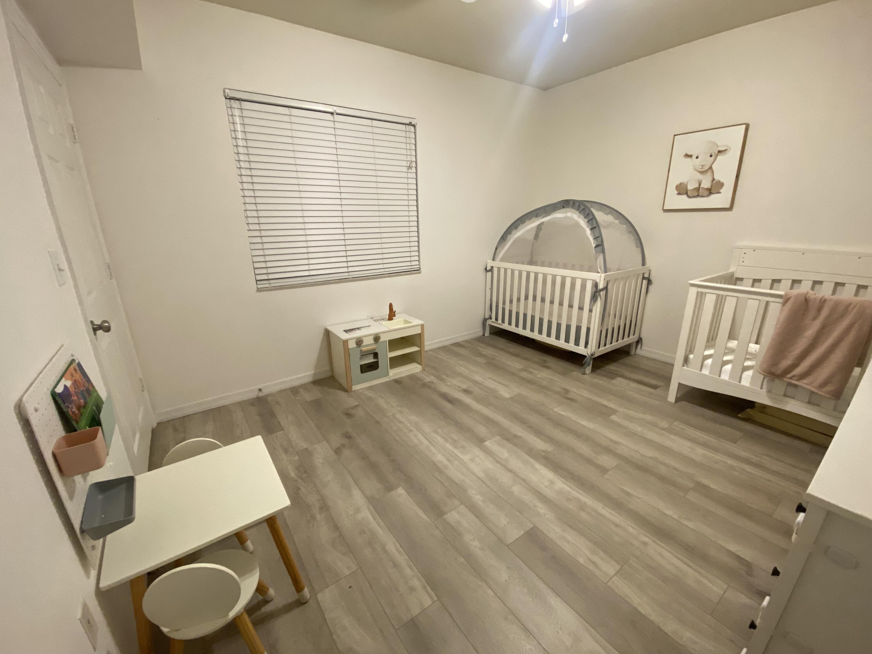 6511 Emerald Dunes Drive, Unit 208 West Palm Beach, FL 33411 - Photo 32 of 51 a living room with furniture and a window