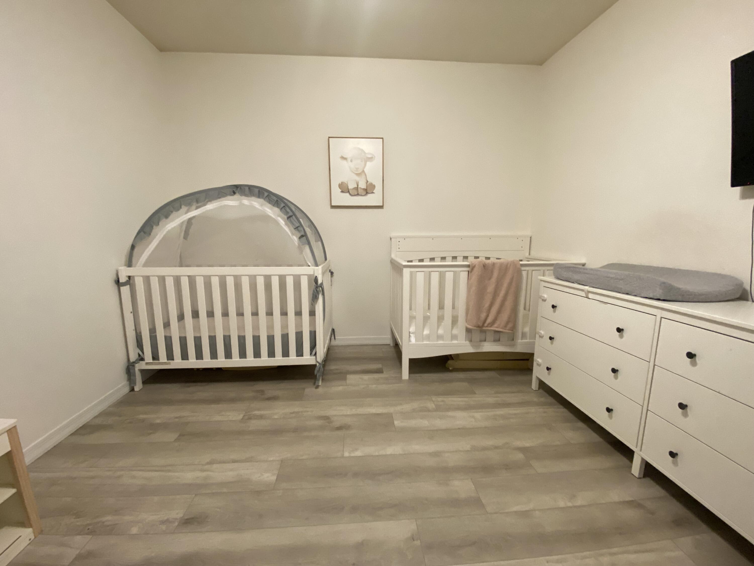 6511 Emerald Dunes Drive, Unit 208 West Palm Beach, FL 33411 - Photo 34 of 51 a view of a bedroom with furniture and window