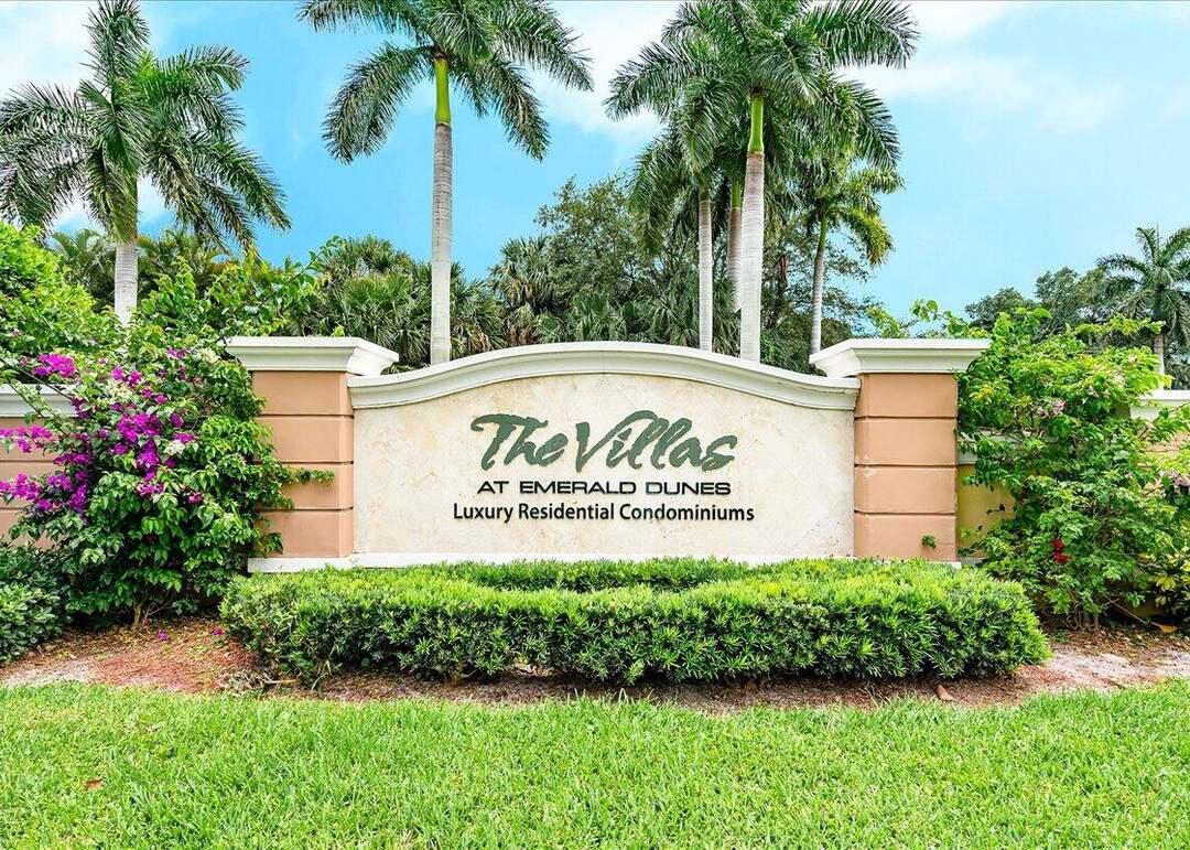 6511 Emerald Dunes Drive, Unit 208 West Palm Beach, FL 33411 - Photo 49 of 51 a sign on the side of a building