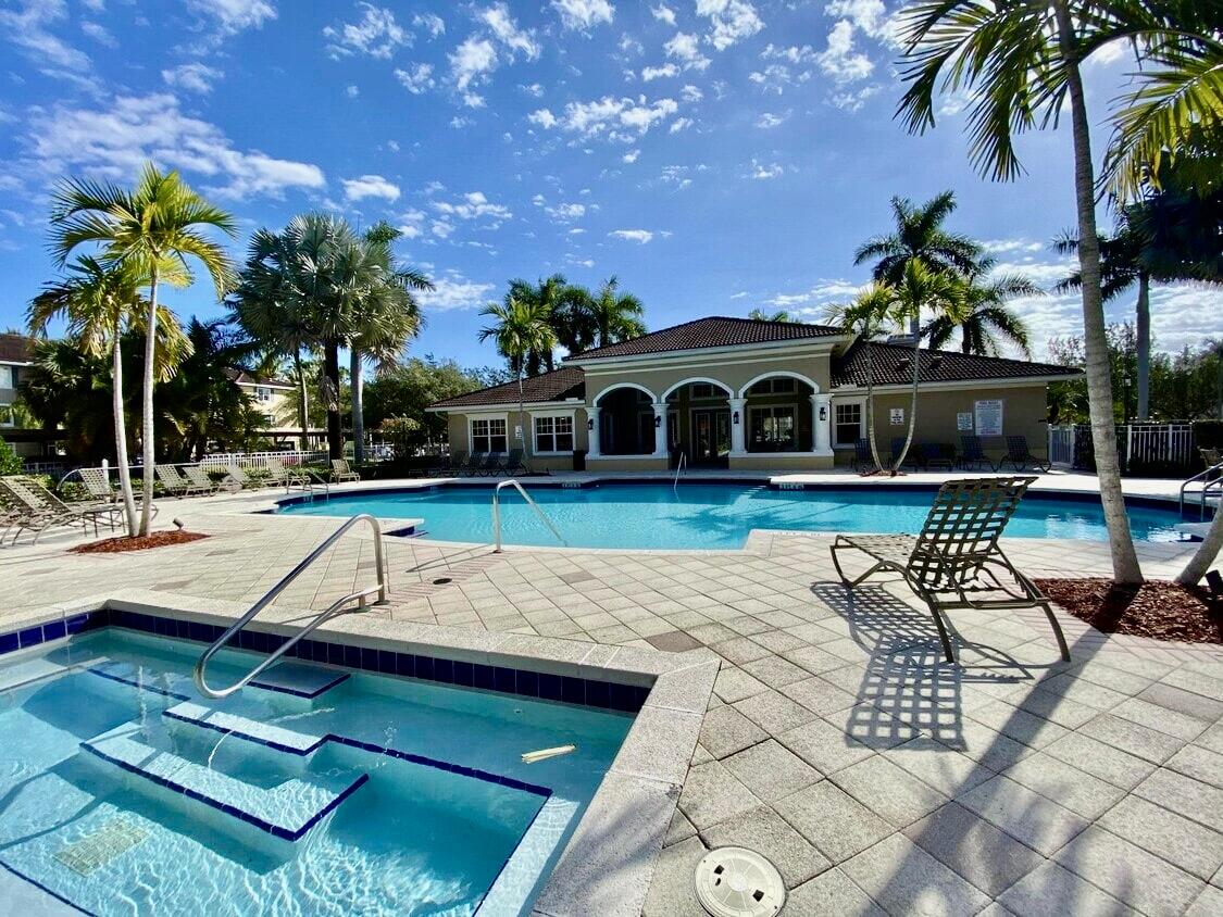 6511 Emerald Dunes Drive, Unit 208 West Palm Beach, FL 33411 - Photo 50 of 51 a house view with a sitting space and garden