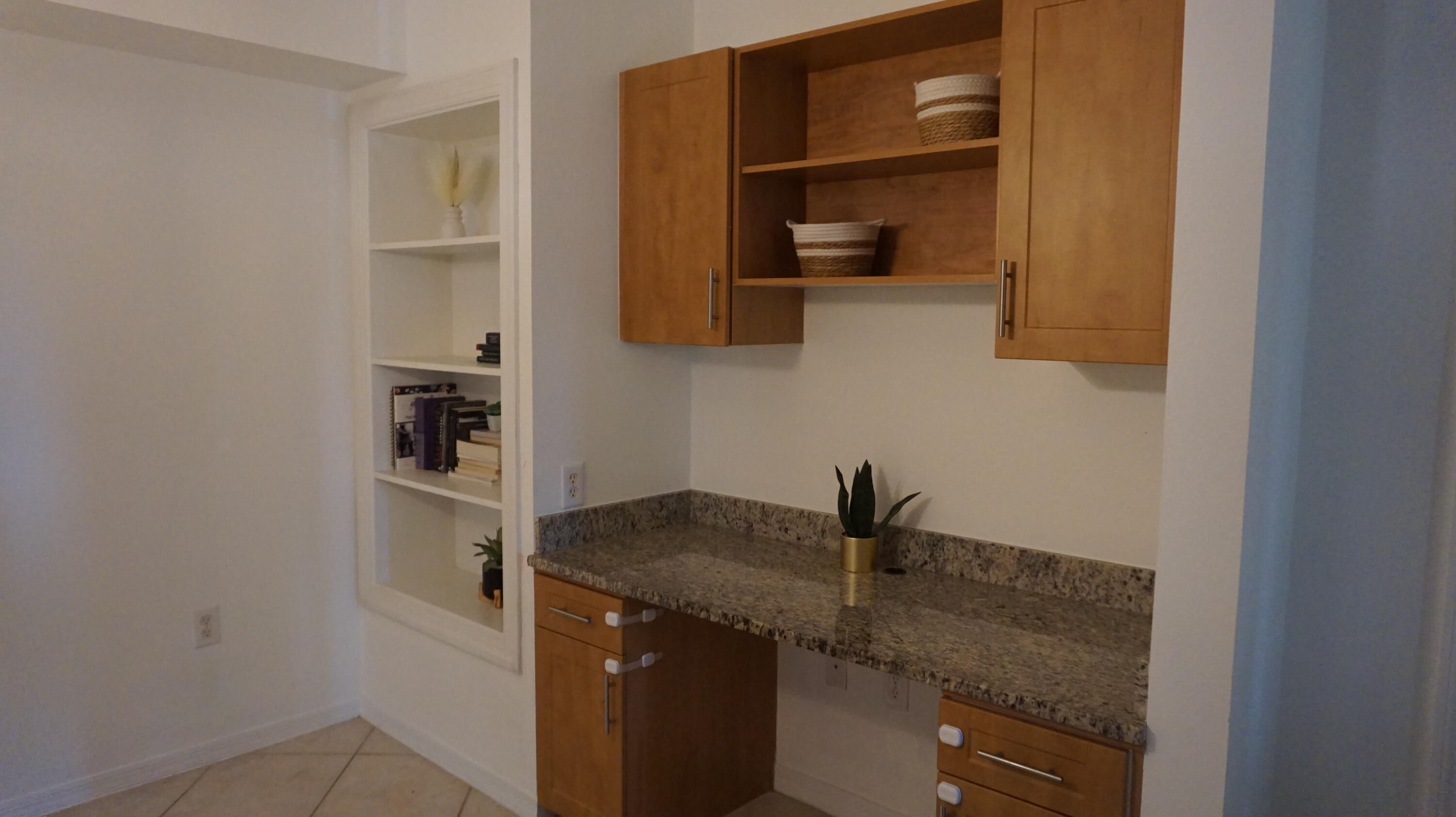 6511 Emerald Dunes Drive, Unit 208 West Palm Beach, FL 33411 - Photo 10 of 51 a kitchen with a sink and cabinets