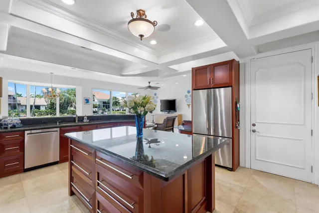 a kitchen with stainless steel appliances granite countertop a sink a counter space and stainless steel appliances
