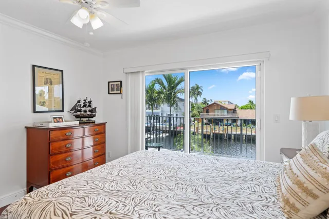 a view of a lake with a bench in front of house