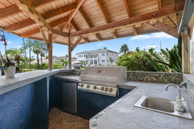 a view of yard with swimming pool outdoor seating and barbeque oven