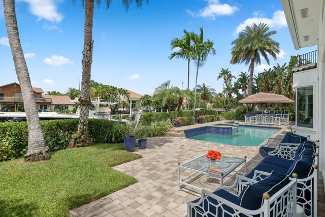 a view of a rooftop deck patio and lake view