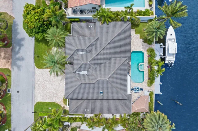 a view of house with swimming pool outdoor seating and wooden floor
