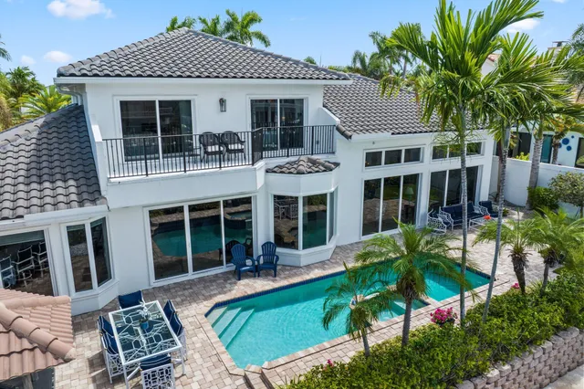 a view of a swimming pool with a yard