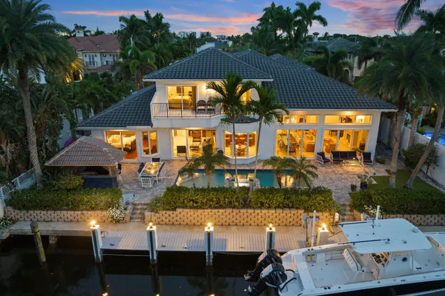 a view of a swimming pool with a table and chairs