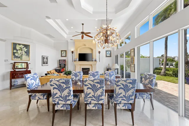 a view of a dining room with furniture wooden floor and chandelier