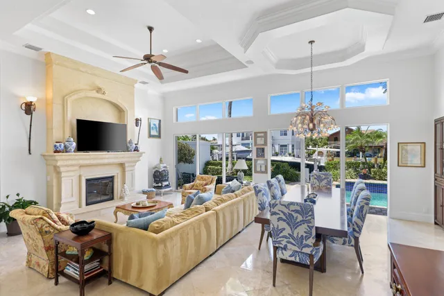 a living room with fireplace furniture and a flat screen tv