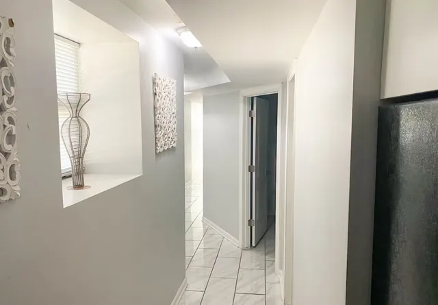 a bedroom with a bed and curtain