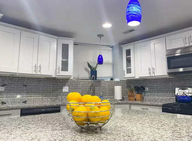 a kitchen with a sink and cabinets