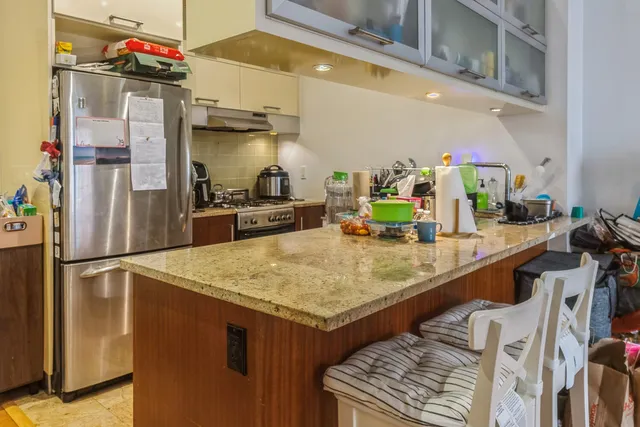 a workspace with furniture wooden floor and a book shelf