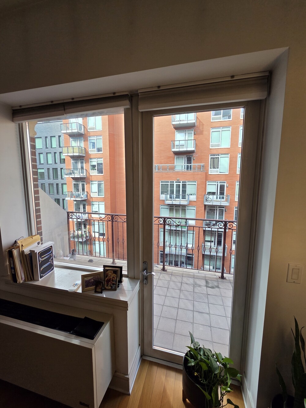 41-26 27th Street, Unit 8B Queens, NY 11101 - Photo 5 of 11 a living room with furniture and large windows
