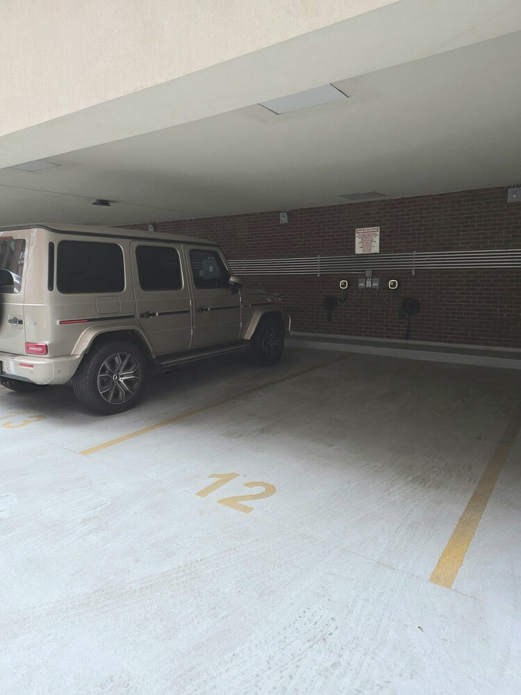 41-26 27th Street, Unit 8B Queens, NY 11101 - Photo 9 of 11 a view of car parked in garage