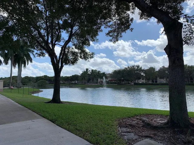 a view of a lake with a yard
