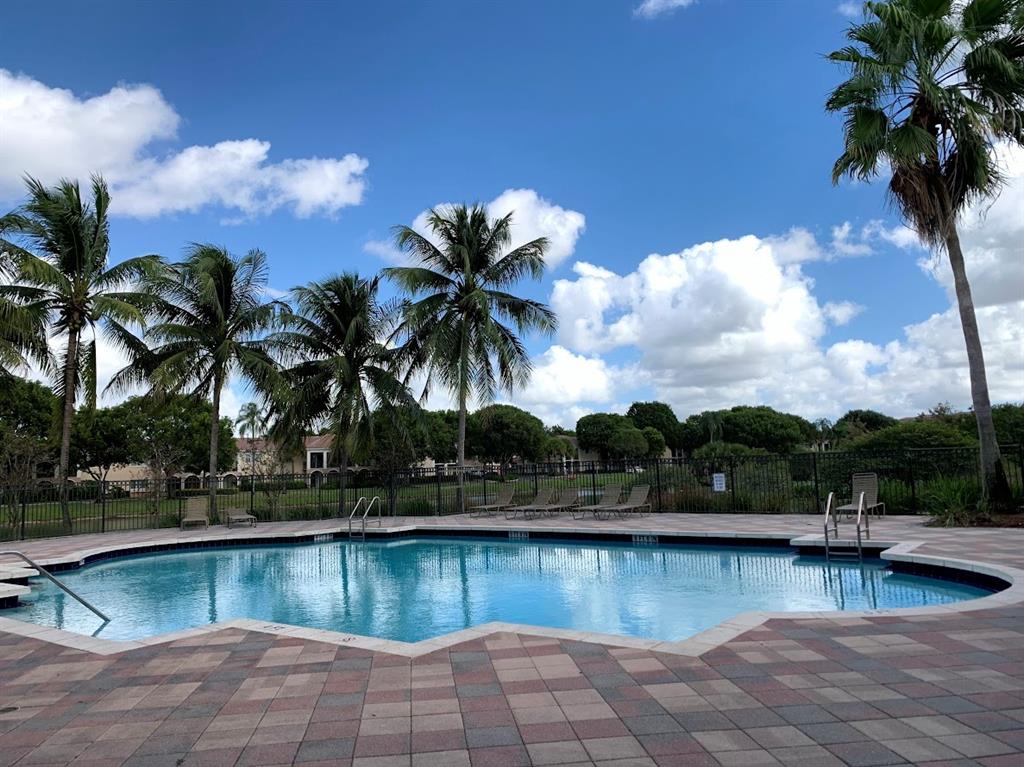 2565 Centergate Drive, Unit 204 Miramar, FL 33025 - Photo 17 of 30 a view of swimming pool with outdoor seating and plants