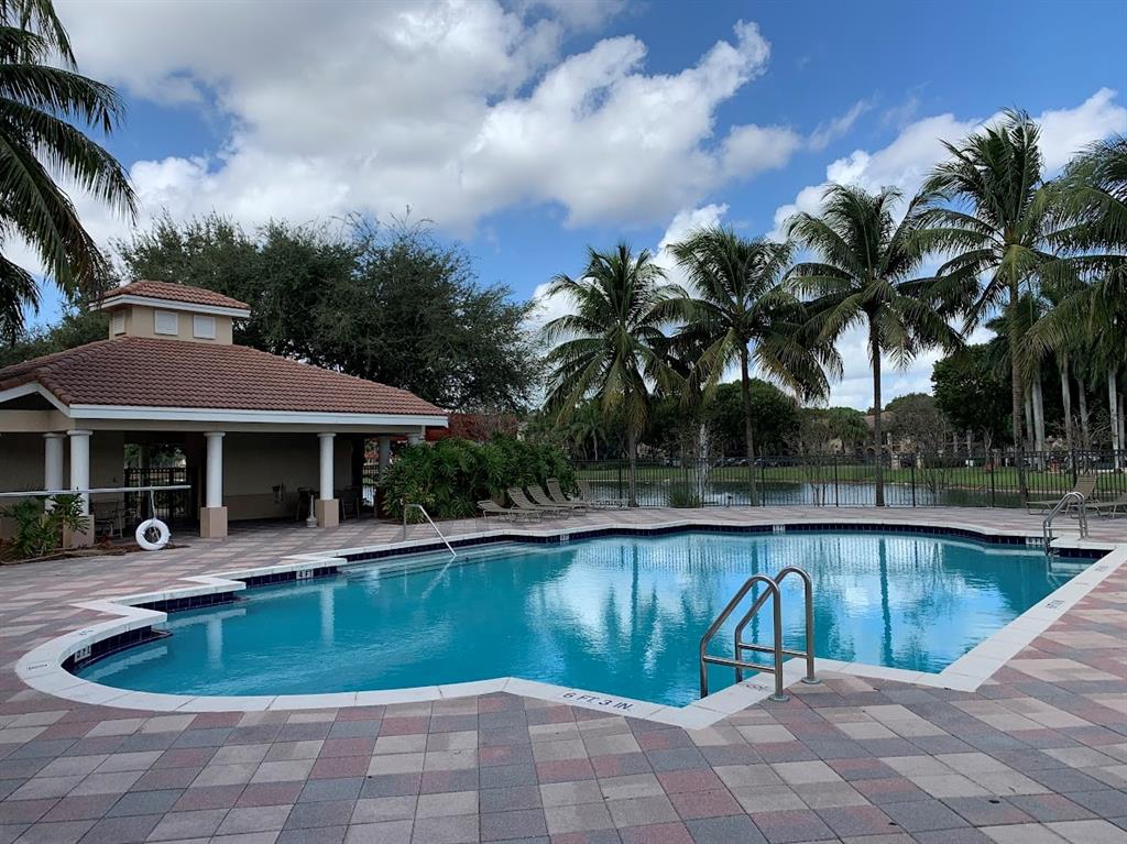 2565 Centergate Drive, Unit 204 Miramar, FL 33025 - Photo 18 of 30 a view of a house with swimming pool and sitting area