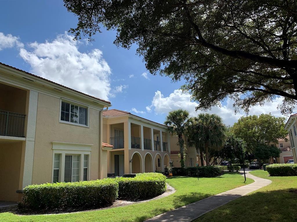 2565 Centergate Drive, Unit 204 Miramar, FL 33025 - Photo 2 of 30 front view of house with a yard