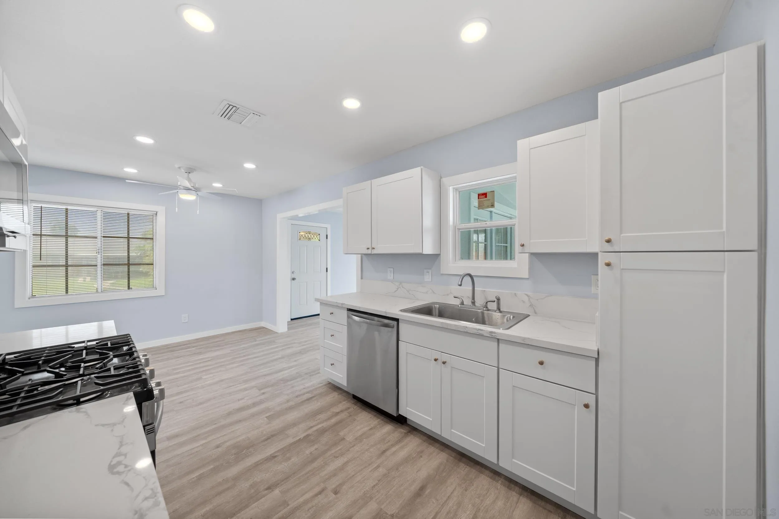 3563 Cannes Avenue Riverside, CA 92501 - Photo 13 of 21 a kitchen with a sink appliances and cabinets