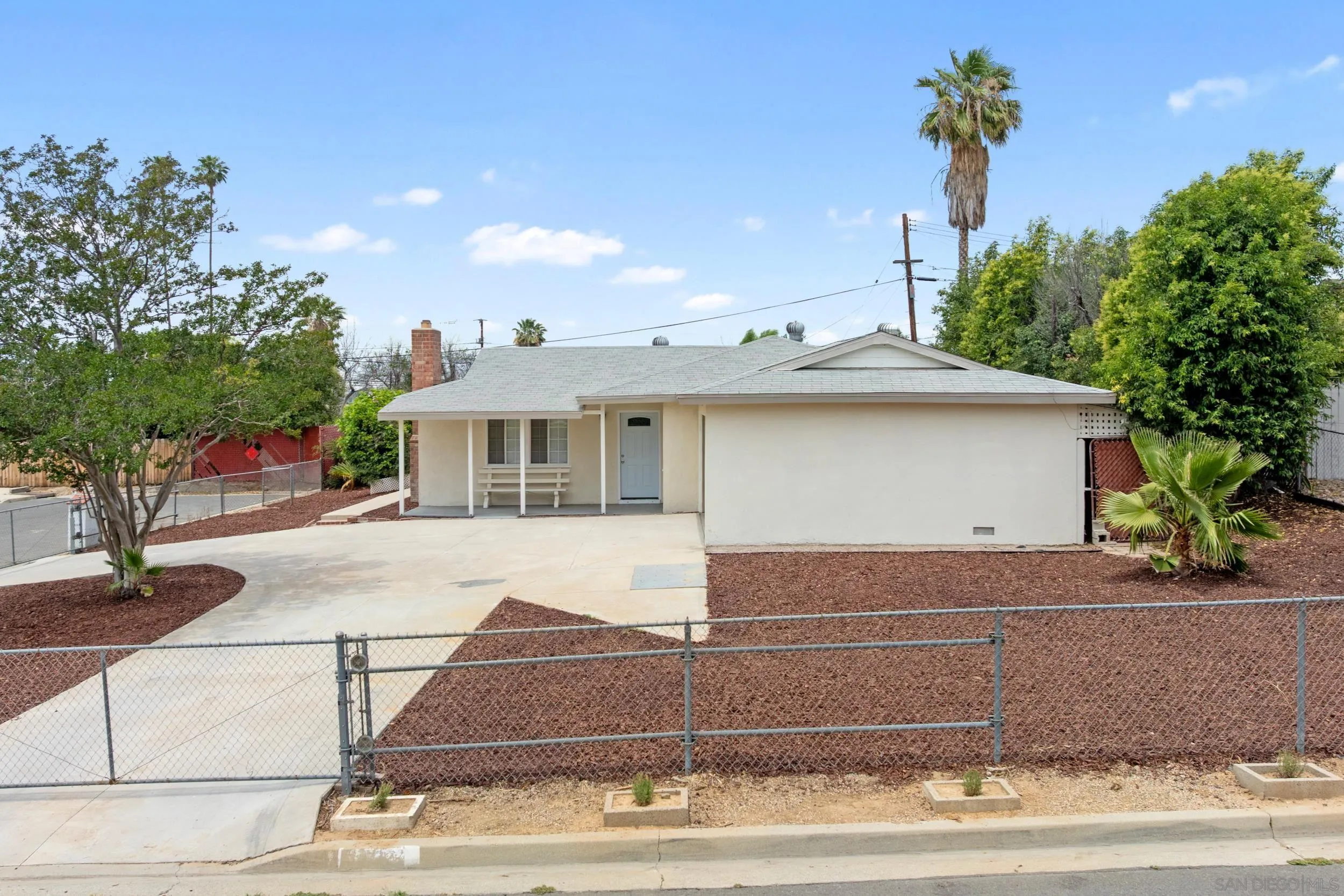 3563 Cannes Avenue Riverside, CA 92501 - Photo 5 of 21 a view of a house with a yard and potted plants