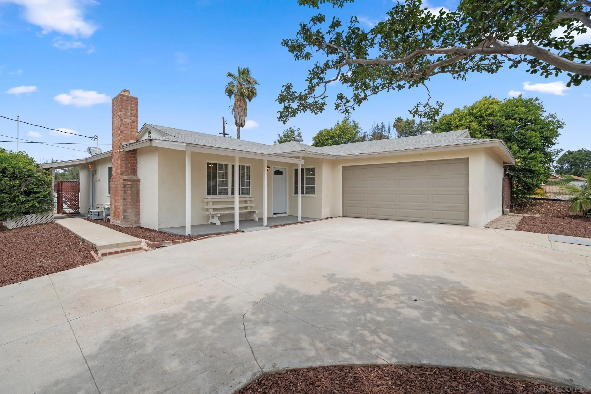 3563 Cannes Avenue Riverside, CA 92501 - Photo 6 of 21 a view of a house with a yard and garage