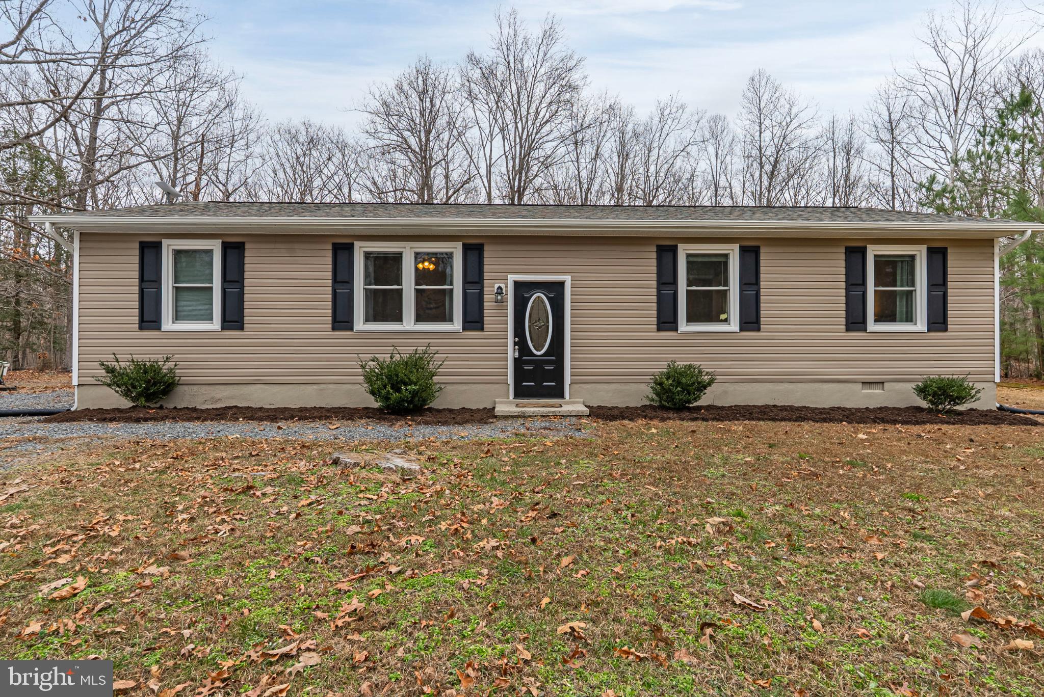 20045 Courtney Road Hanover, VA 23069 - Photo 1 of 21 a backyard of a house with large trees and barbeque oven