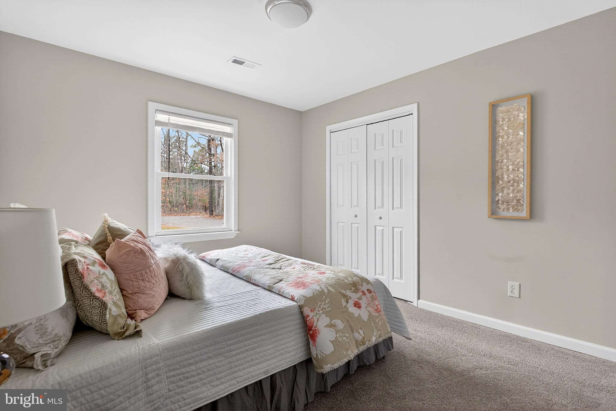 20045 Courtney Road Hanover, VA 23069 - Photo 11 of 21 a bedroom with a bed and a window