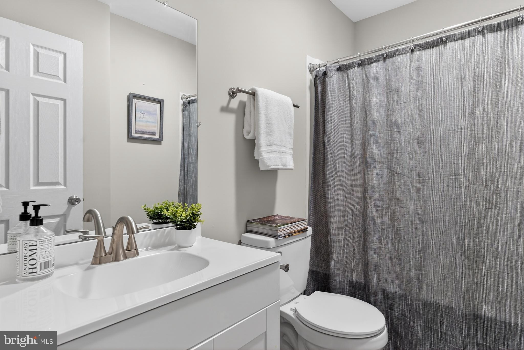20045 Courtney Road Hanover, VA 23069 - Photo 12 of 21 a bathroom with a sink toilet and shower