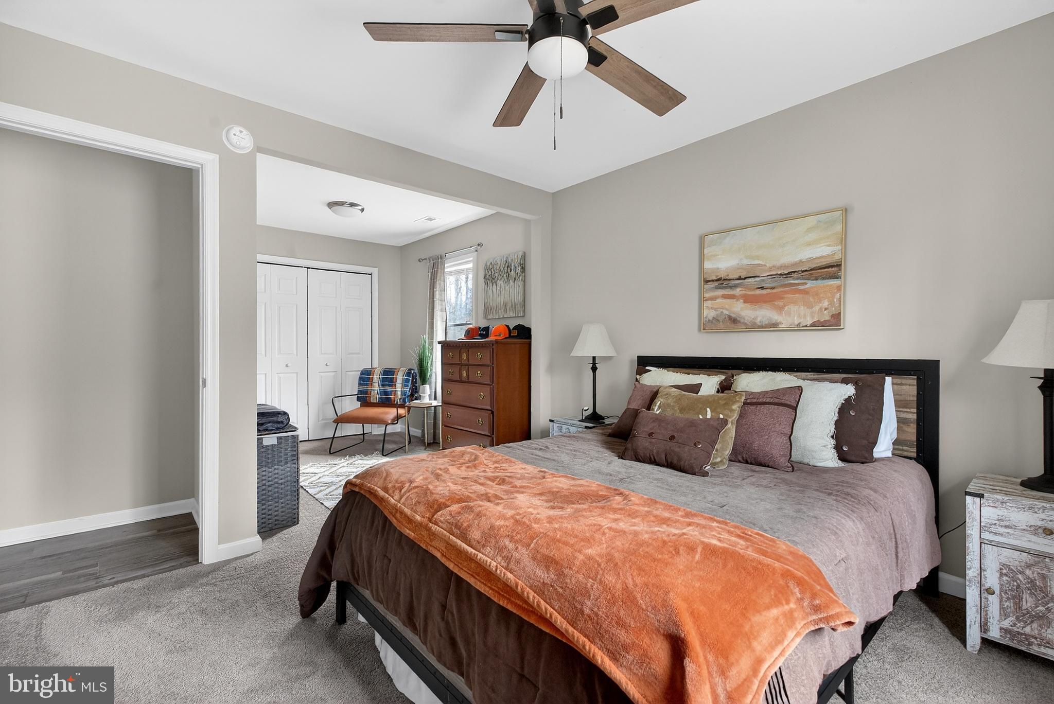 20045 Courtney Road Hanover, VA 23069 - Photo 14 of 21 a bedroom with a large bed and a chandelier