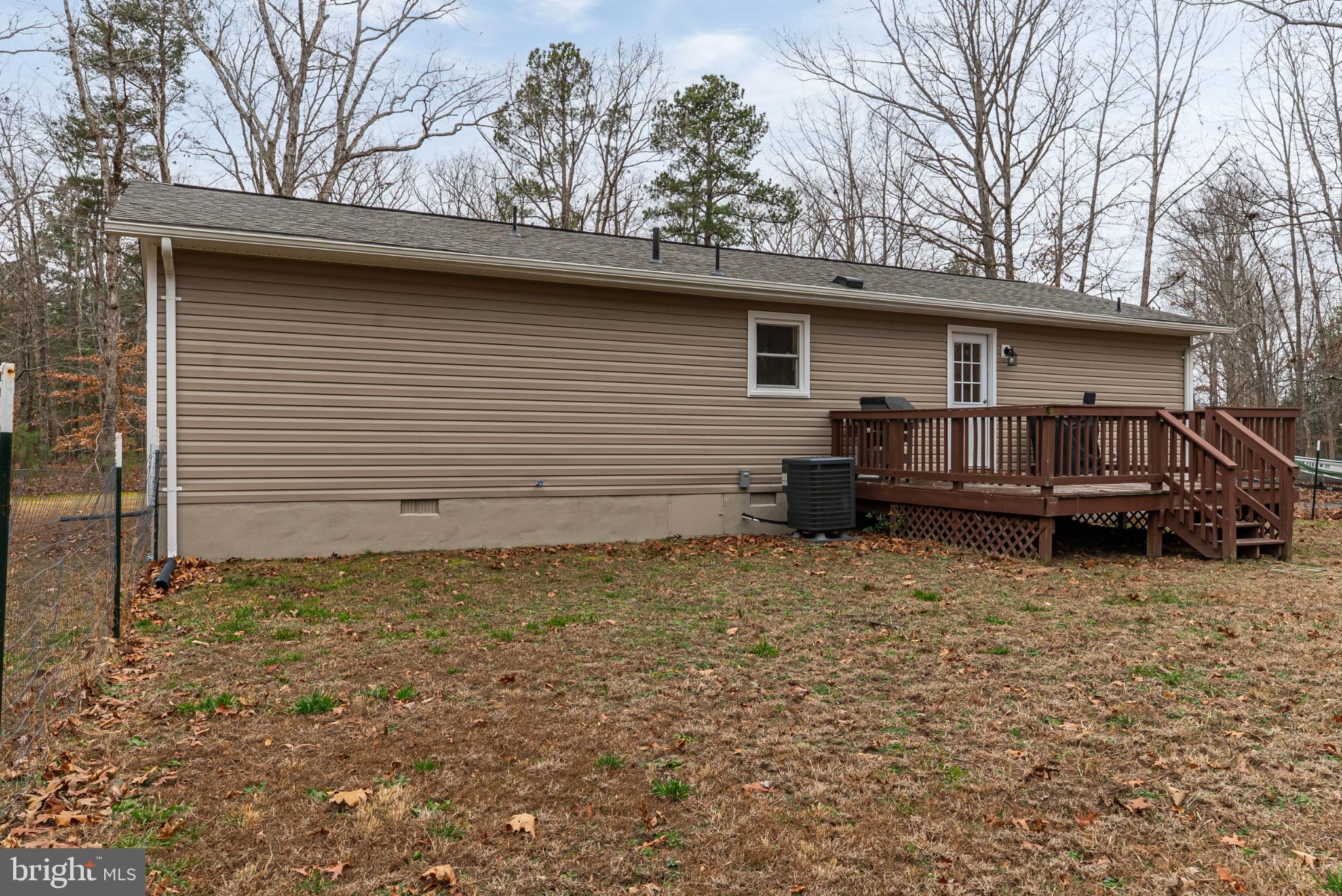 20045 Courtney Road Hanover, VA 23069 - Photo 19 of 21 a backyard of a house with barbeque oven table and chairs