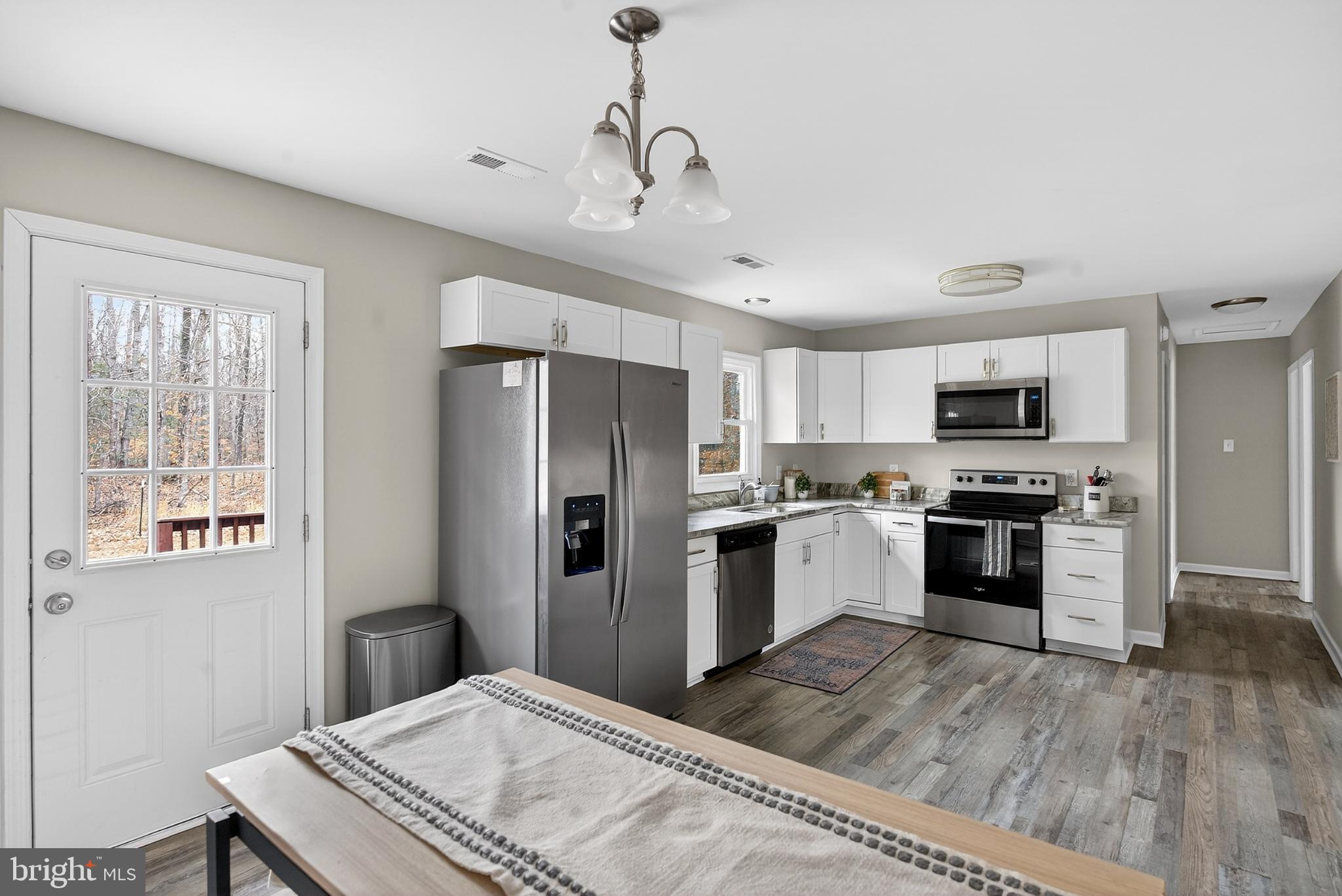 20045 Courtney Road Hanover, VA 23069 - Photo 9 of 21 a kitchen with a refrigerator stove and microwave