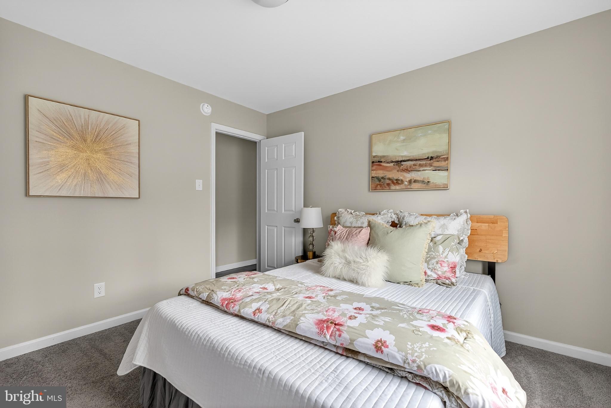 20045 Courtney Road Hanover, VA 23069 - Photo 10 of 21 a bedroom with a bed and painting on the wall