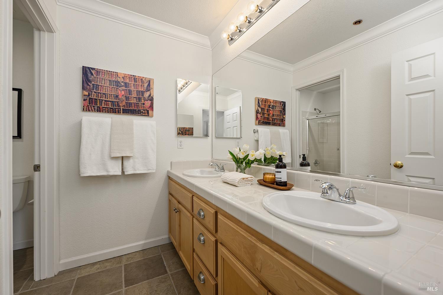 38 Maybeck Street Novato, CA 94949 - Photo 41 of 47 a bathroom with a sink and a mirror