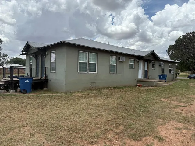a house with trees in the background